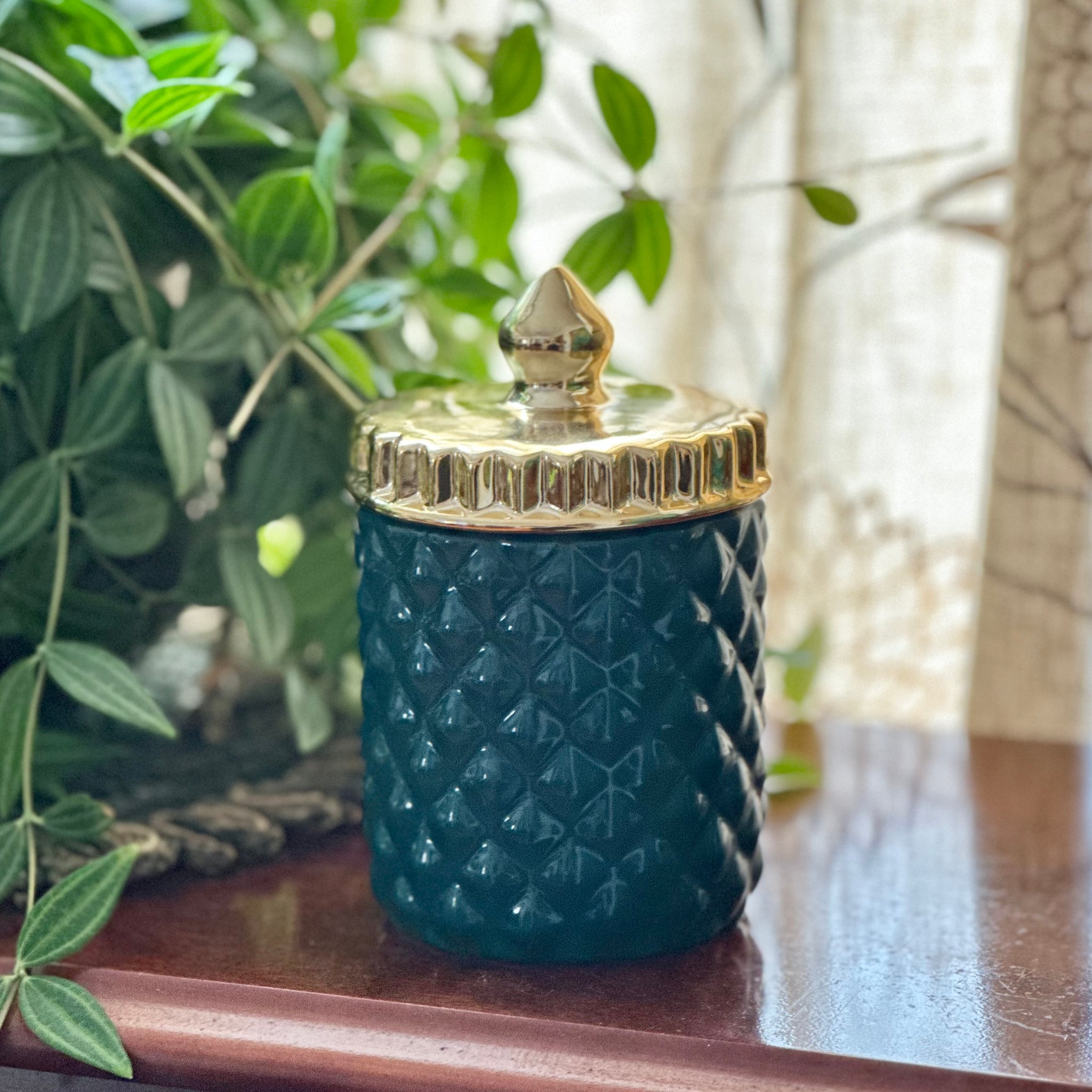 Green and gold jar candle